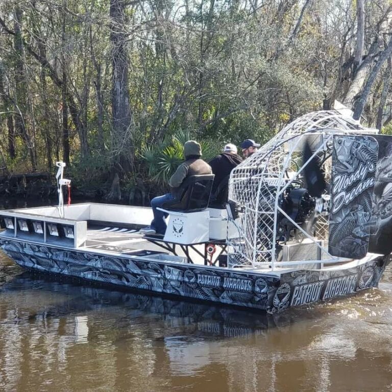 A blue camo Patriot working flooded woods