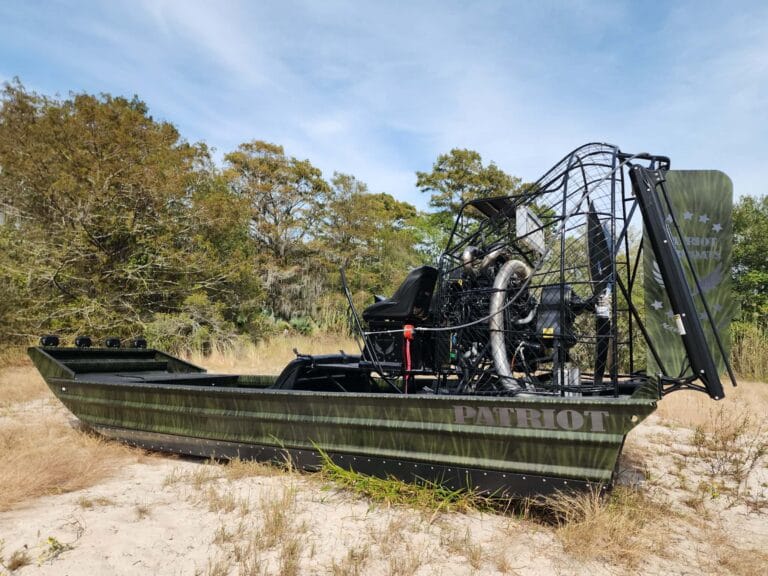 A dark green hunting rig on the sand