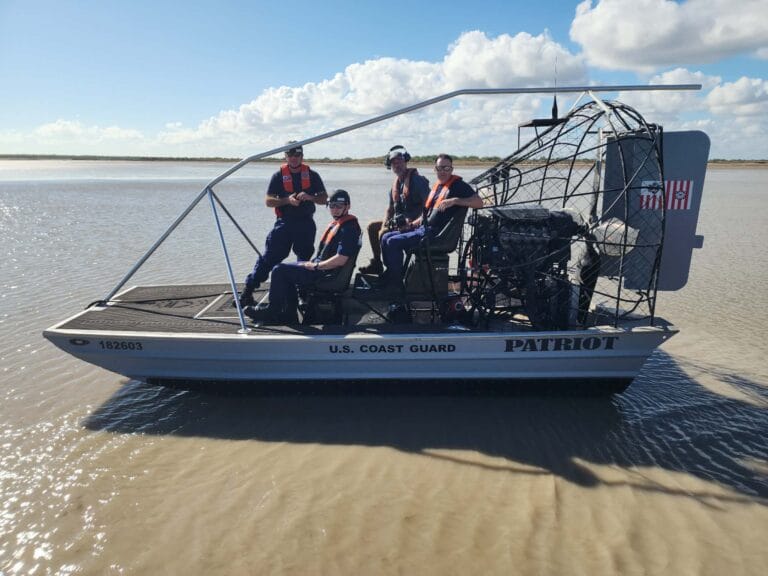 A U.S. Coast Guard crew aboard their Patriot on a sandbar
