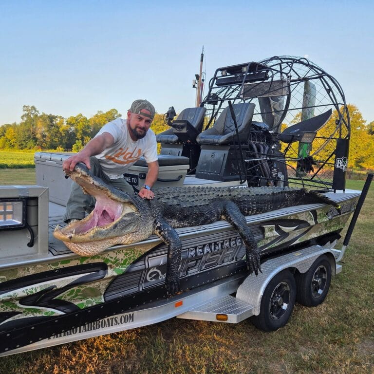 A gator on the deck of a camo Patriot