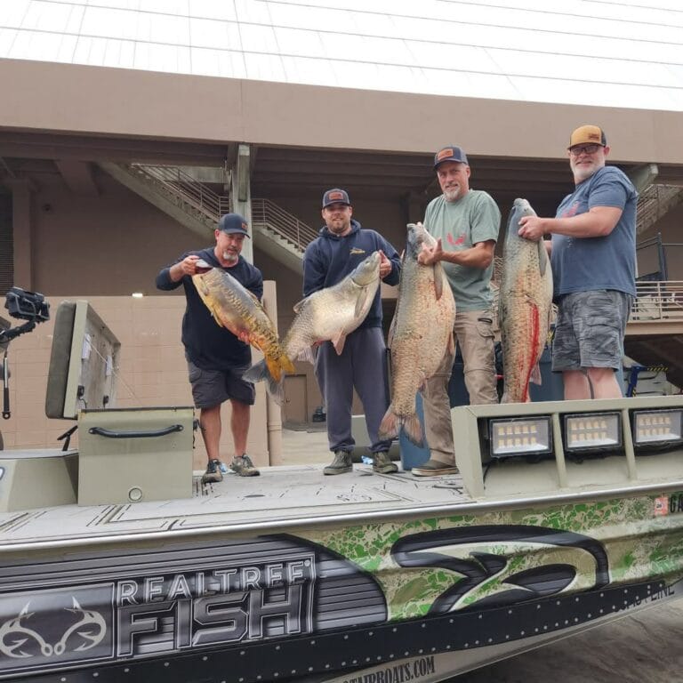 Four anglers with big gar at the shop