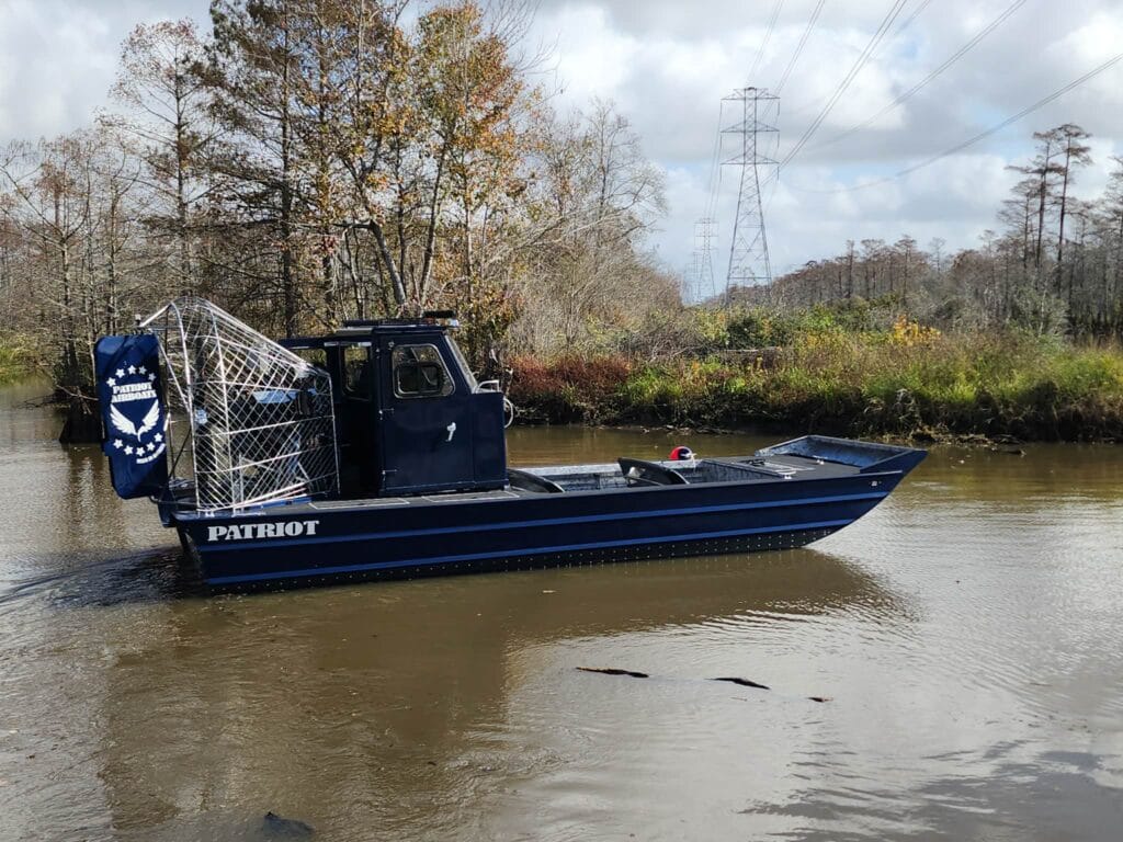 A navy blue Patriot running flooded timber