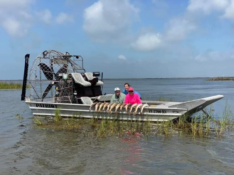 A couple and their catch on the deck