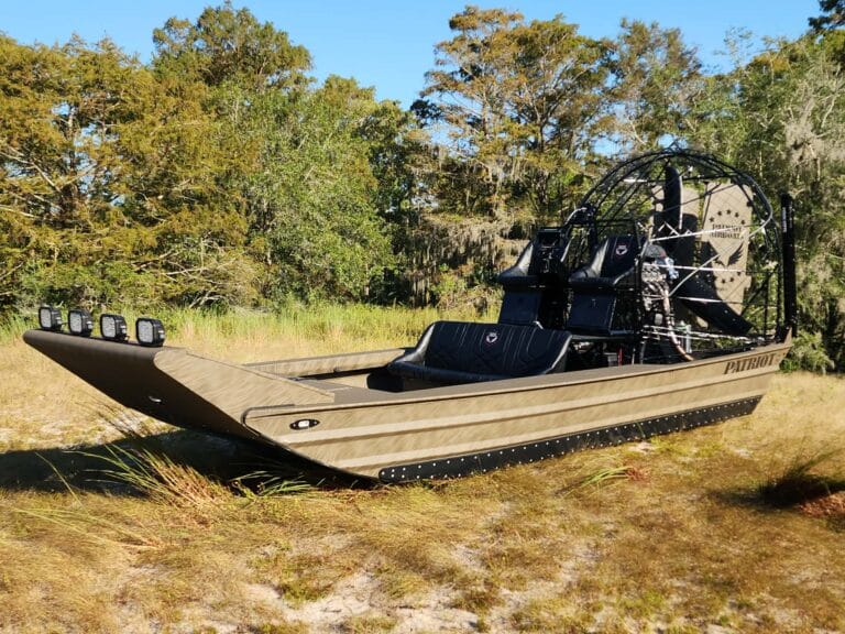 A hunting airboat pulled up in the trees