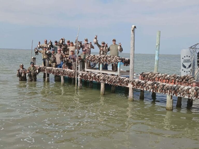A big duck hunting party lined up on the dock