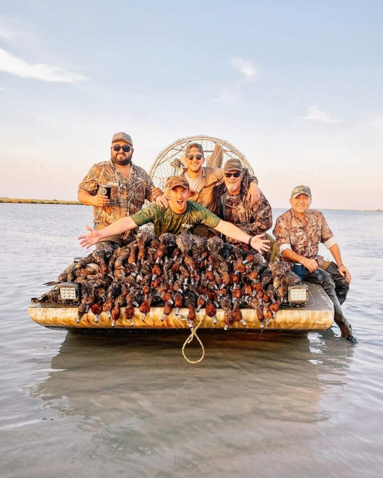 Duck hunters on the bow with the day's limit