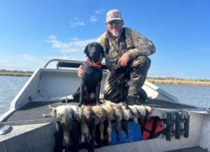 man and dog on a duck hunt with panther airboat