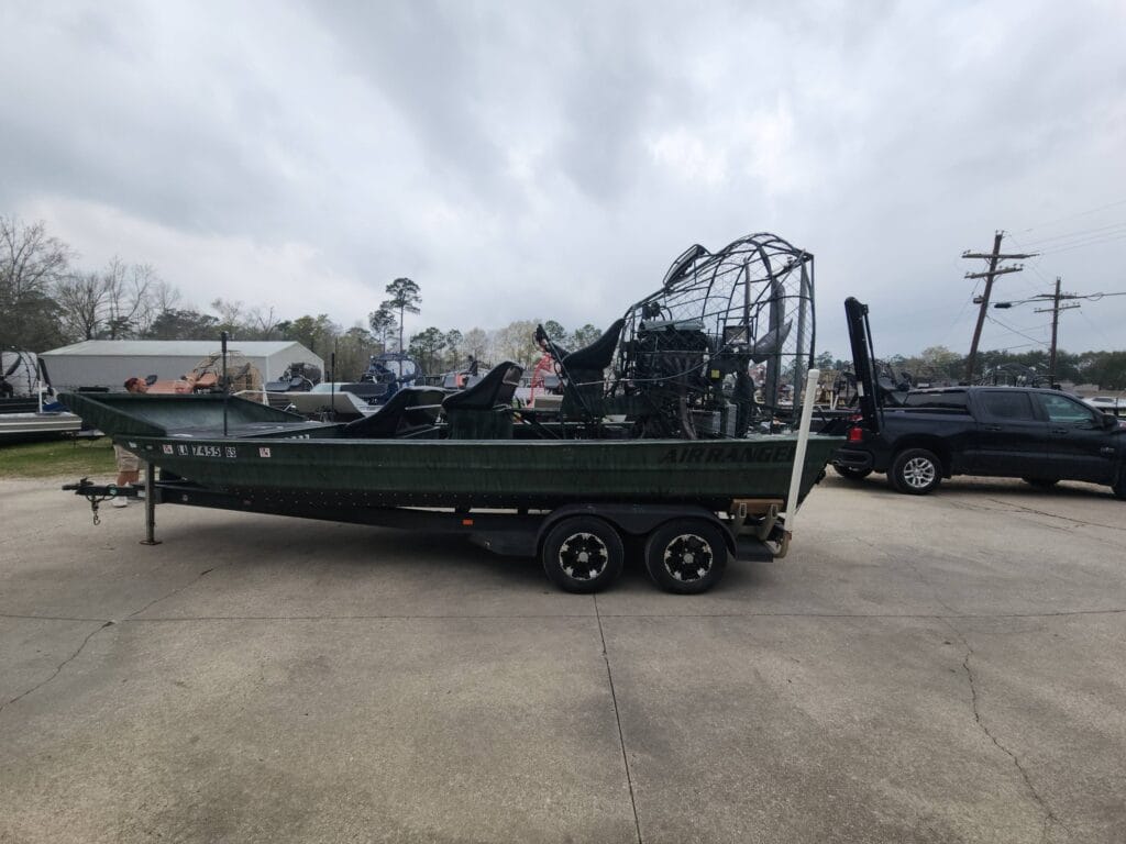 Used AirRanger airboat on a tandem trailer at the Patriot lot in Vidor, Texas