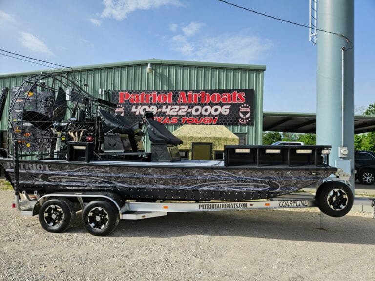 A black Patriot under the shop sign in Vidor