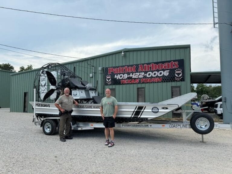 A patrol airboat on its trailer outside the Patriot shop