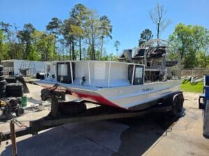 2007 Silver Dollar 18x8 airboat on its trailer, front quarter view