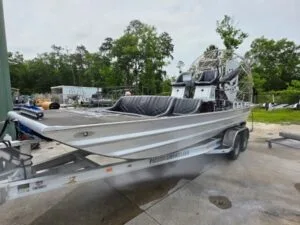 Patriot airboat with black diamond-stitched seats on a Patriot tandem trailer
