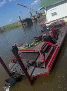 2019 Swamp Shark mud boat from the stern with Power-Poles, at the dock