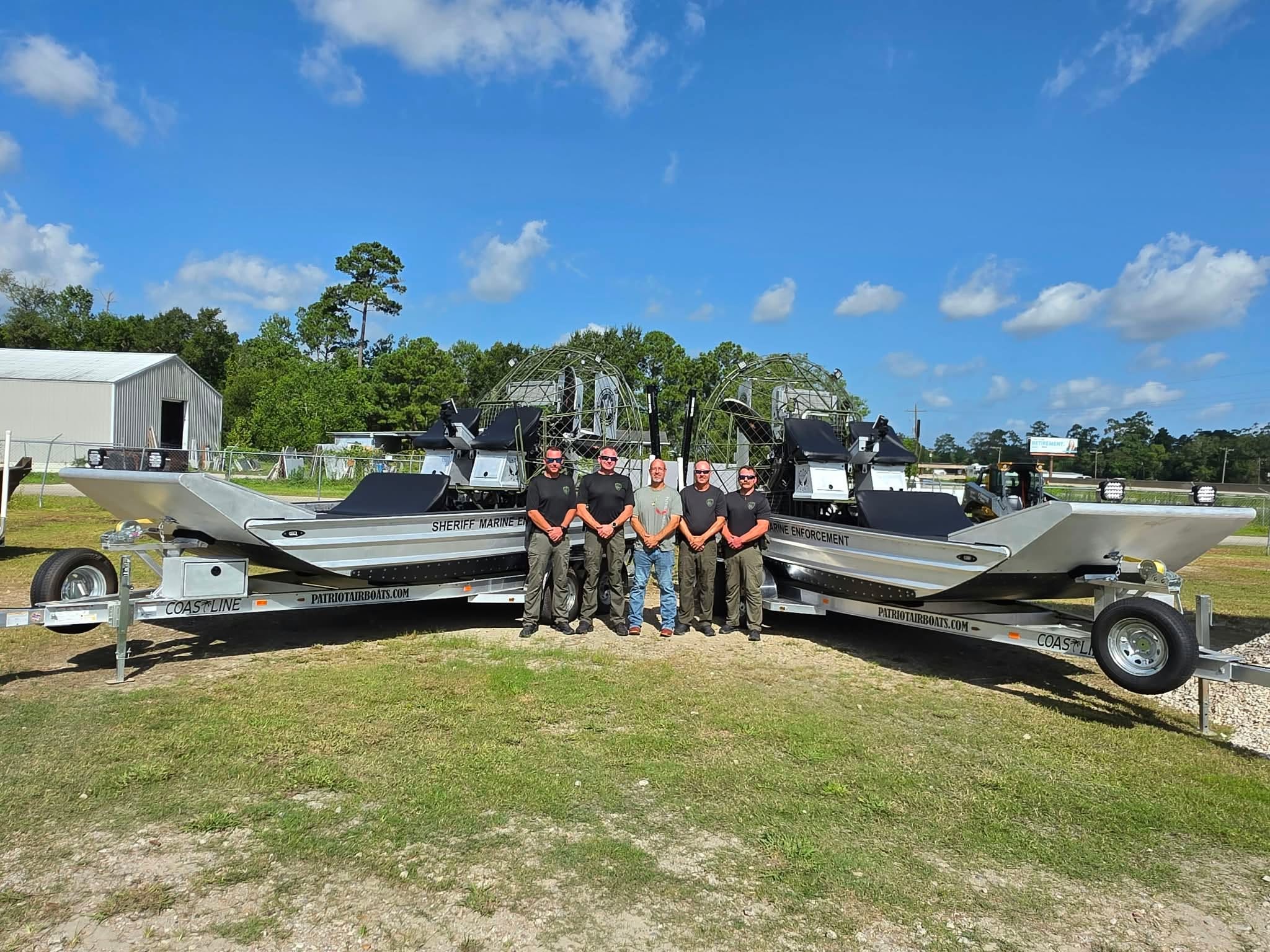Faron Floyd of Patriot Airboats with Calcasieu Parish Sheriff's Office deputies at the handover