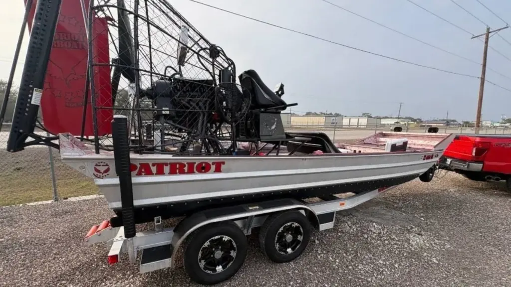 A 2025 Patriot 20x8 airboat on its tandem trailer at the Patriot shop in Vidor, Texas