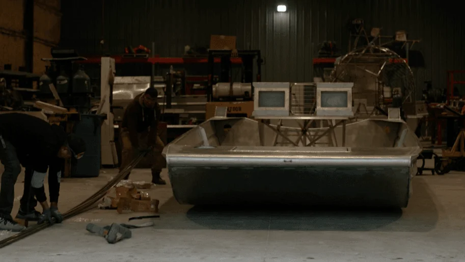 Custom airboat build time starts here: a bare aluminum airboat hull on the Patriot shop floor in Vidor, Texas