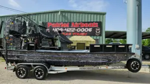 Used airboat inspection at Patriot Airboat Corp. in Vidor, Texas: a Patriot airboat on its trailer outside the shop